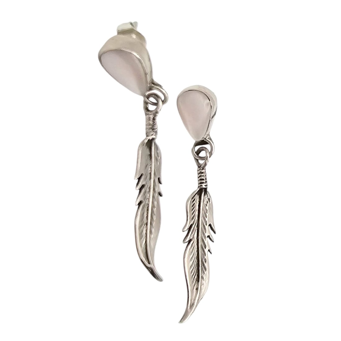 Navajo Sterling Silver Mother-of-Pearl Feather Earrings: Navajo-designed sterling silver earrings featuring a teardrop-shaped mother of pearl inlay connected by a detailed feather motif. The earrings weigh 4.1 grams combined and feature a post-back closure