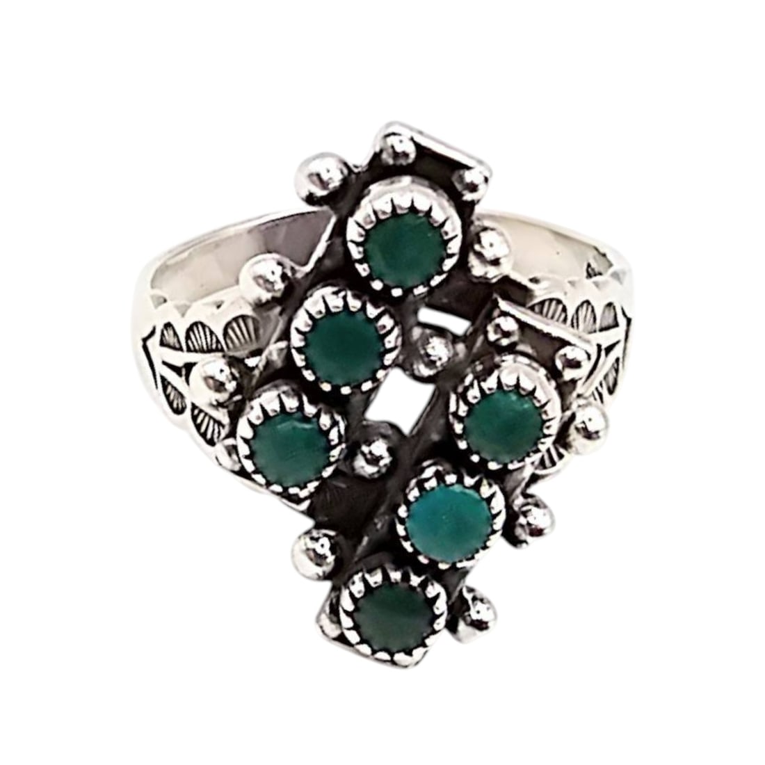 Navajo Sterling Silver Turquoise Ring Size 7: Navajo-made sterling silver ring featuring a cluster of turquoise stones. The ring is a size 7 and weighs approximately 4 grams. The design showcases intricate silverwork with multiple turquoise stone