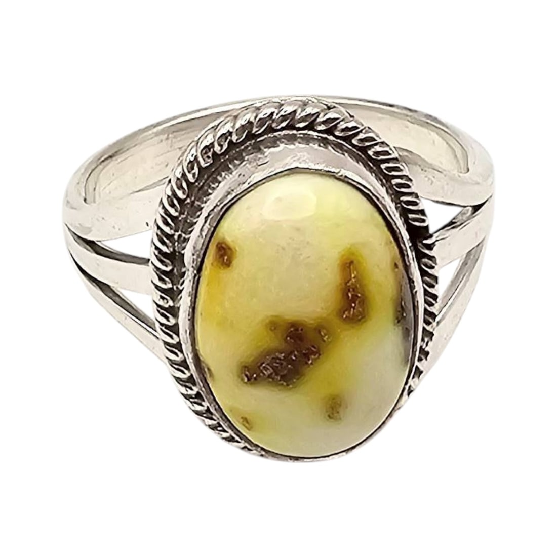 Sterling Silver Oval Ring with Yellow-Brown Stone Size 7.5: Sterling silver ring featuring an oval cabochon yellow stone with brown inclusions. The setting includes a twisted rope border and a split shank band design. The ring weighs 4.7 grams and includes a