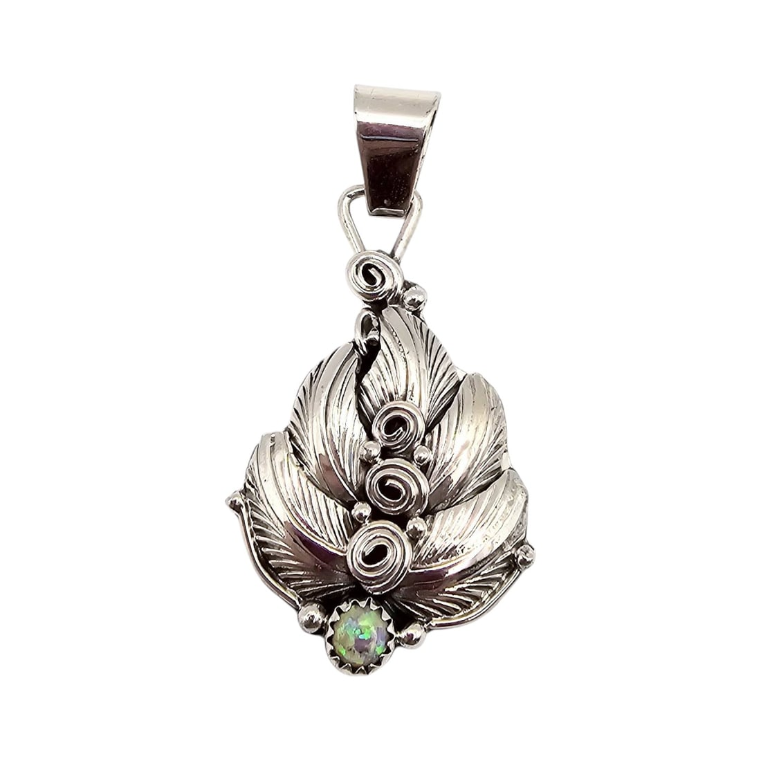 Navajo Darrell Morgan Sterling Silver Opal Pendant: Sterling silver pendant handcrafted by Navajo artist Darrell Morgan, featuring intricate feather designs and spiraled details. The pendant includes a vibrant opal accent at the base. Stamped with the