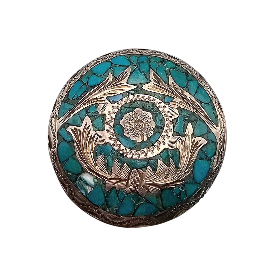 Mexican Taxco Sterling Silver Turquoise Brooch/Pendant: Round brooch/pendant made in Taxco, Mexico, crafted of sterling silver with inlaid turquoise stone pieces and detailed silver floral designs. Measures approximately 2 inches in diameter. Features a pi