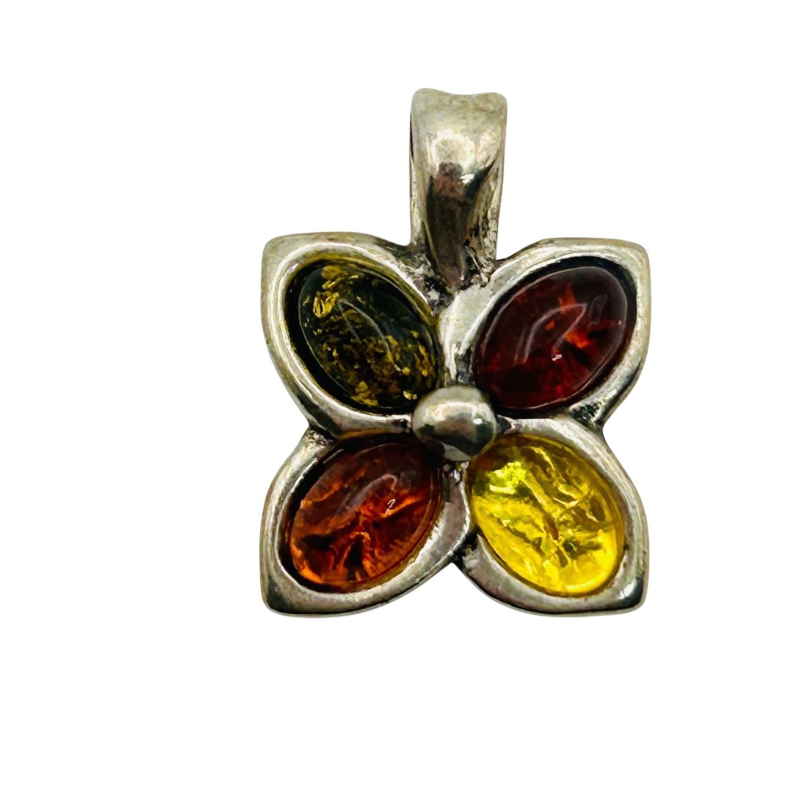 Sterling Amber Flower Pendant: Sterling Amber flower pendant. 2.00g
