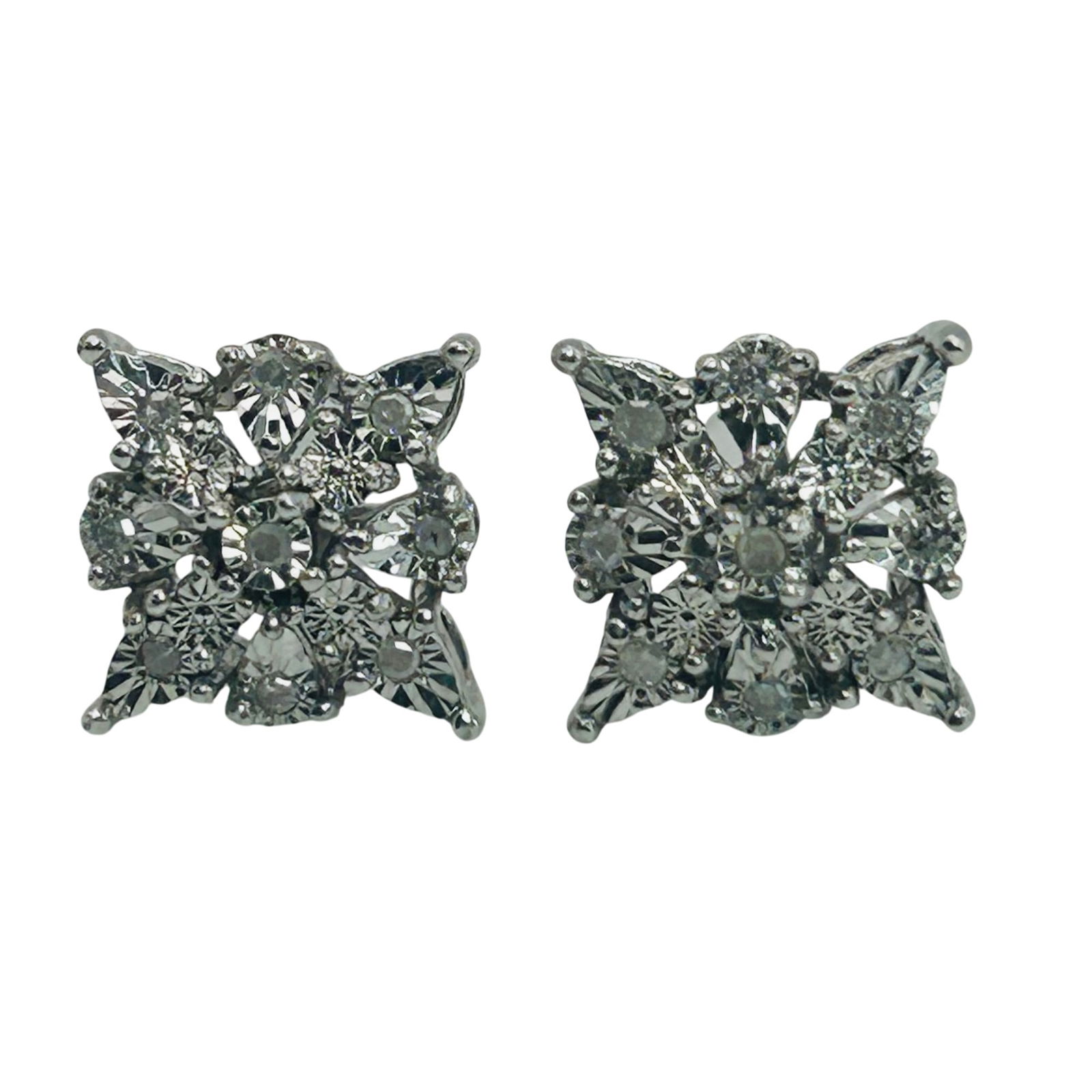Sterling Moissanite Flower Design Stud Earrings: Sterling moissanite flower design stud earrings. 2.00g