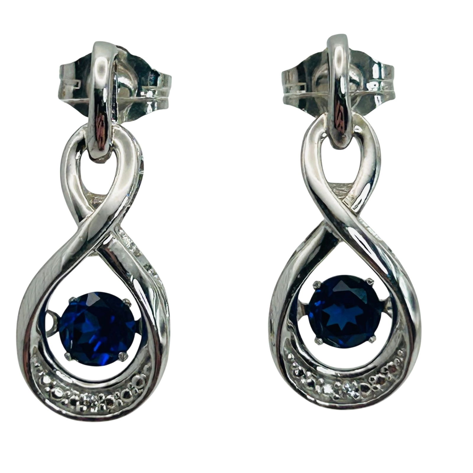 Sterling Tanzanite Infinity Stud Earrings: Sterling tanzanite infinity stud earrings. 2.60g