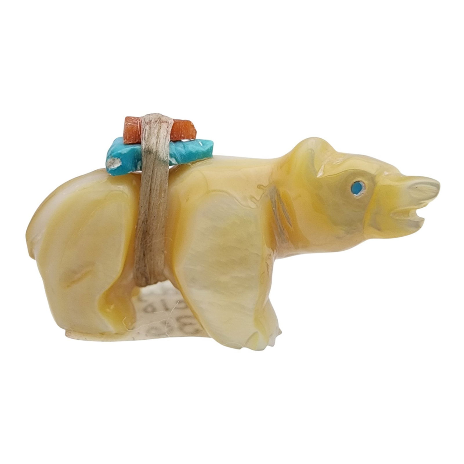 Randy Lucio Zuni Mother of Pearl Offering Bear Fetish: Randy Lucio Zuni Mother of Pearl, Turquoise, and Coral Offering Bear Fetish / Approximate Weight: 5g / Approximate measurements: 1.1" x .5" x .6" / Note 1: Comes with copy of the original receipt and