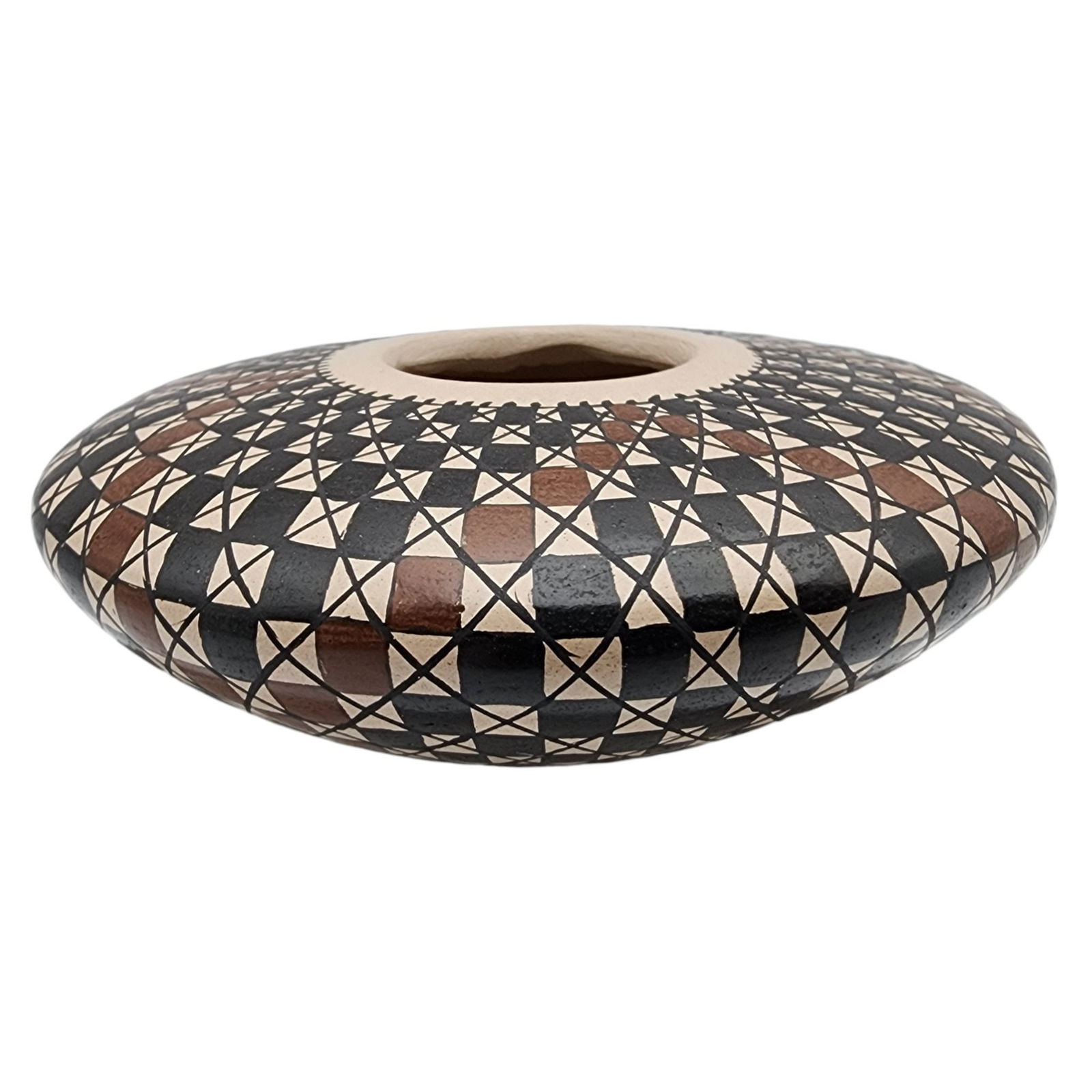 Carmen Veloz Mata Ortiz Eye Dazzler Seed Jar: Carmen Veloz Mata Ortiz Eye Dazzler Seed Jar / 60g / 1.1"h x 3.3d / This item is part of an estate collection of Native American fetishes, pottery, baskets, and rugs acquired by a collector who