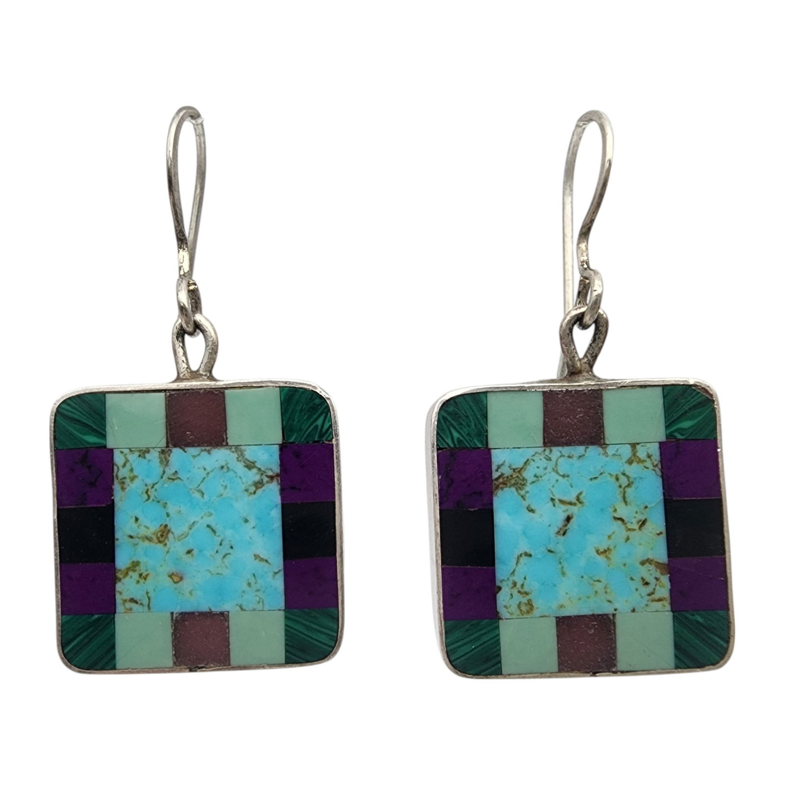 Signed Navajo Sterling Reversible Multistone Earrings: Signed DA Navajo Sterling Reversible Multistone (Turquoise, Malachite, Sugilite, Onyx, Amethyst?) Earrings | 4.8g, notes - small chip in turquoise inlay - possibly not a chip and just a part of the na