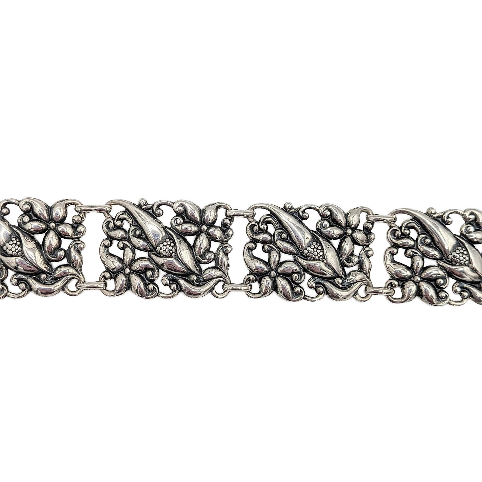 Danecraft Sterling Silver Wide Floral Link Bracelet: Danecraft Sterling Silver Pressed Wide Floral Link Bracelet. 9in Length. Signed Danecraft Sterling Rec Us Pat Off. 23.4g