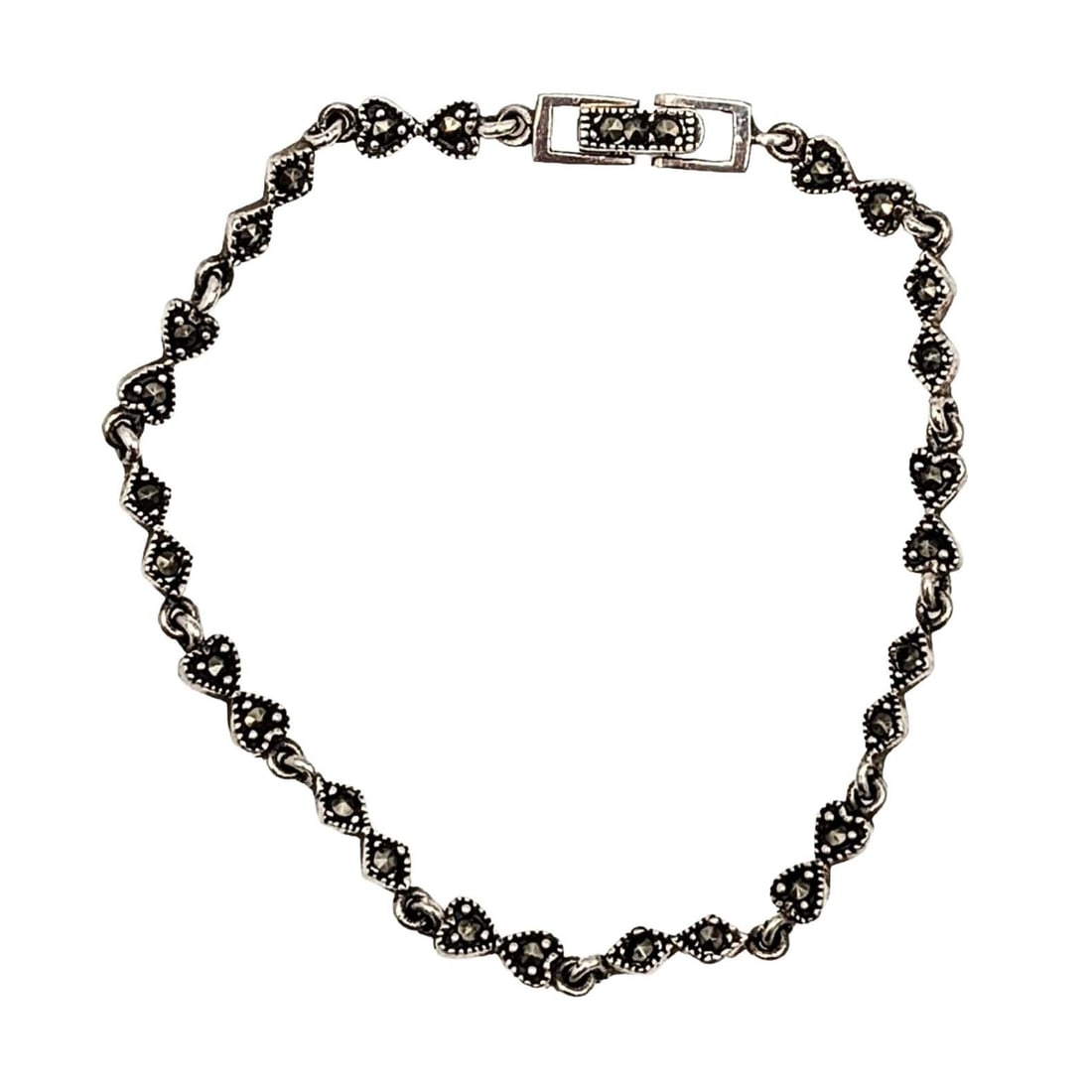 Signed Sterling Silver Marcasite Bow Detail Tennis Bracelet: Signed Sterling Silver, Marcasite Bow Detail Tennis Bracelet. 8.25in Length. Signed 925 I. 6.3g