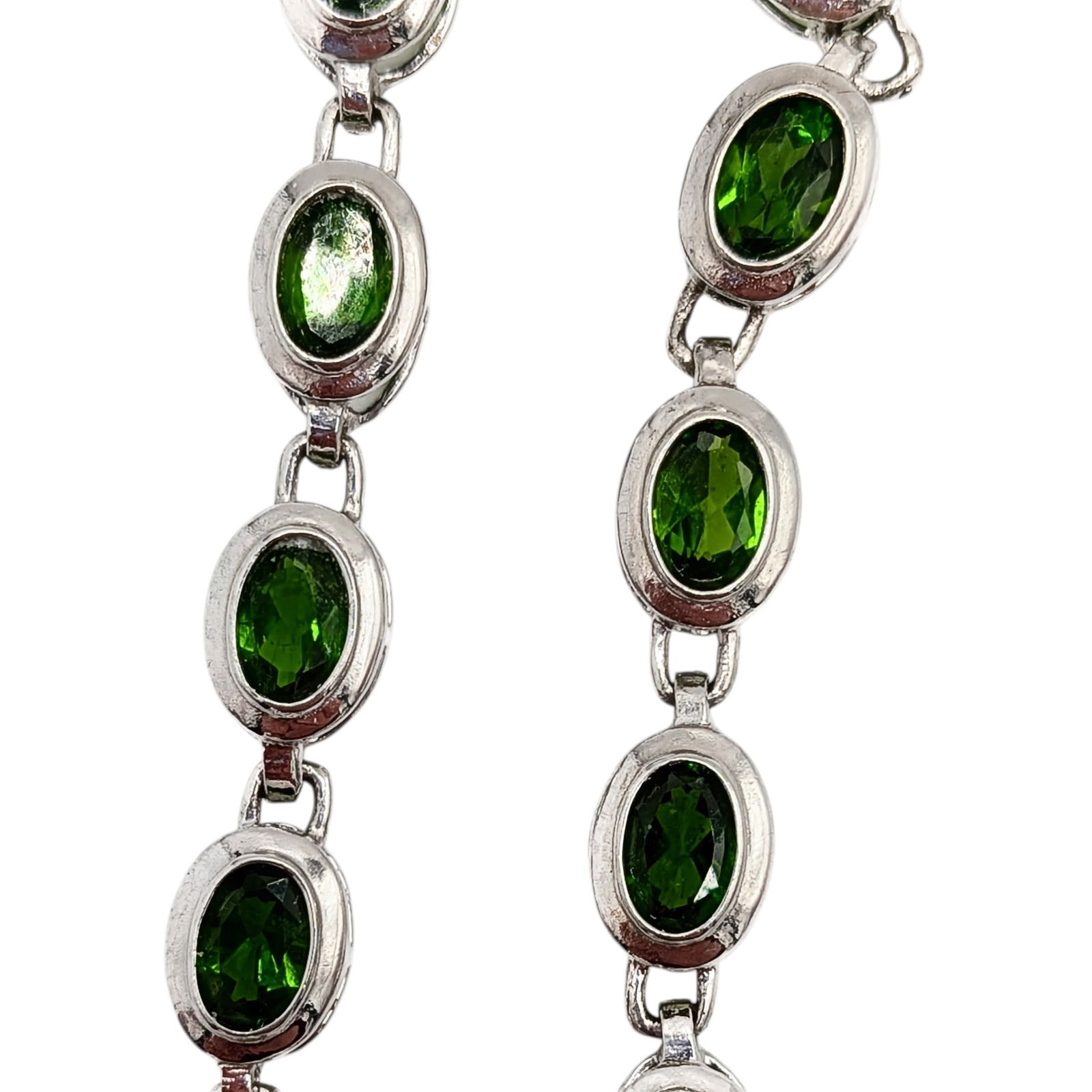 Signed Sterling Silver Emerald Tennis Bracelet: Signed Sterling Silver, Emerald Oval Tennis Bracelet. 9.5in Length. Signed DK 925. 8.4g