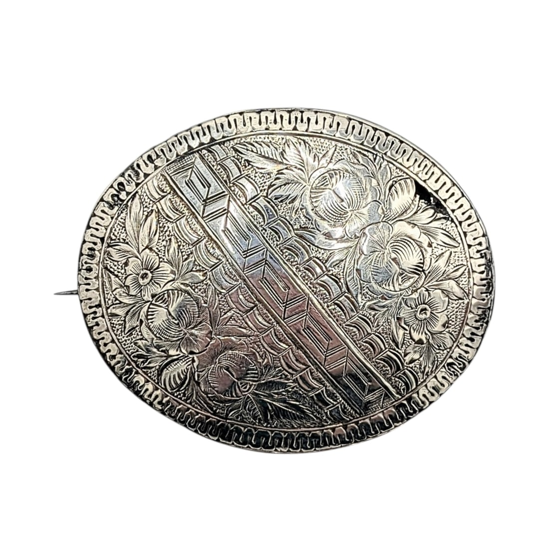 Victorian Sterling Silver Hand Engraved Oval Brooch: Victorian Sterling Silver Hand Engraved Floral Greek Key Oval Brooch. AS IS small hole. Unsigned. 11.8g