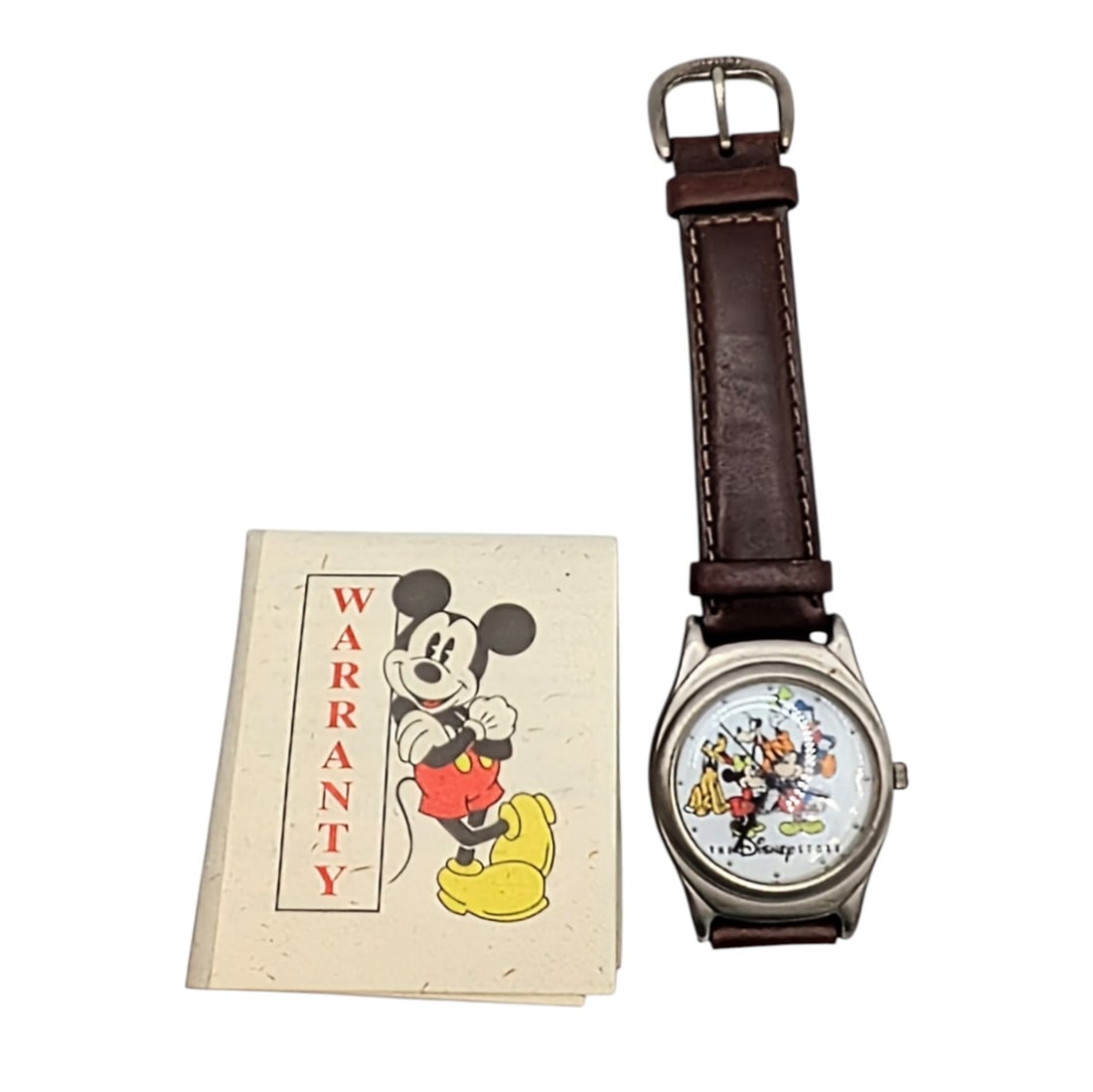 Disney Fossil Stainless Steel Leather Disney Store Commemorative Watch: Disney Fossil Stainless Steel, Leather Disney Store Cast Commemorative Watch. 10.5in Length. Signed Disney Japan. 34.1g