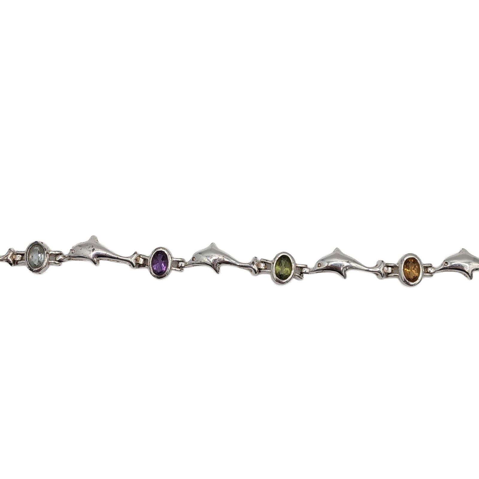 Signed Sterling Silver Multi Gemstone Dolphin Link Bracelet: Signed Sterling Silver, Amethyst, Citrine, Garnet, Peridot, Topaz Dolphin Link Bracelet. Signed SU 925 China. 9g