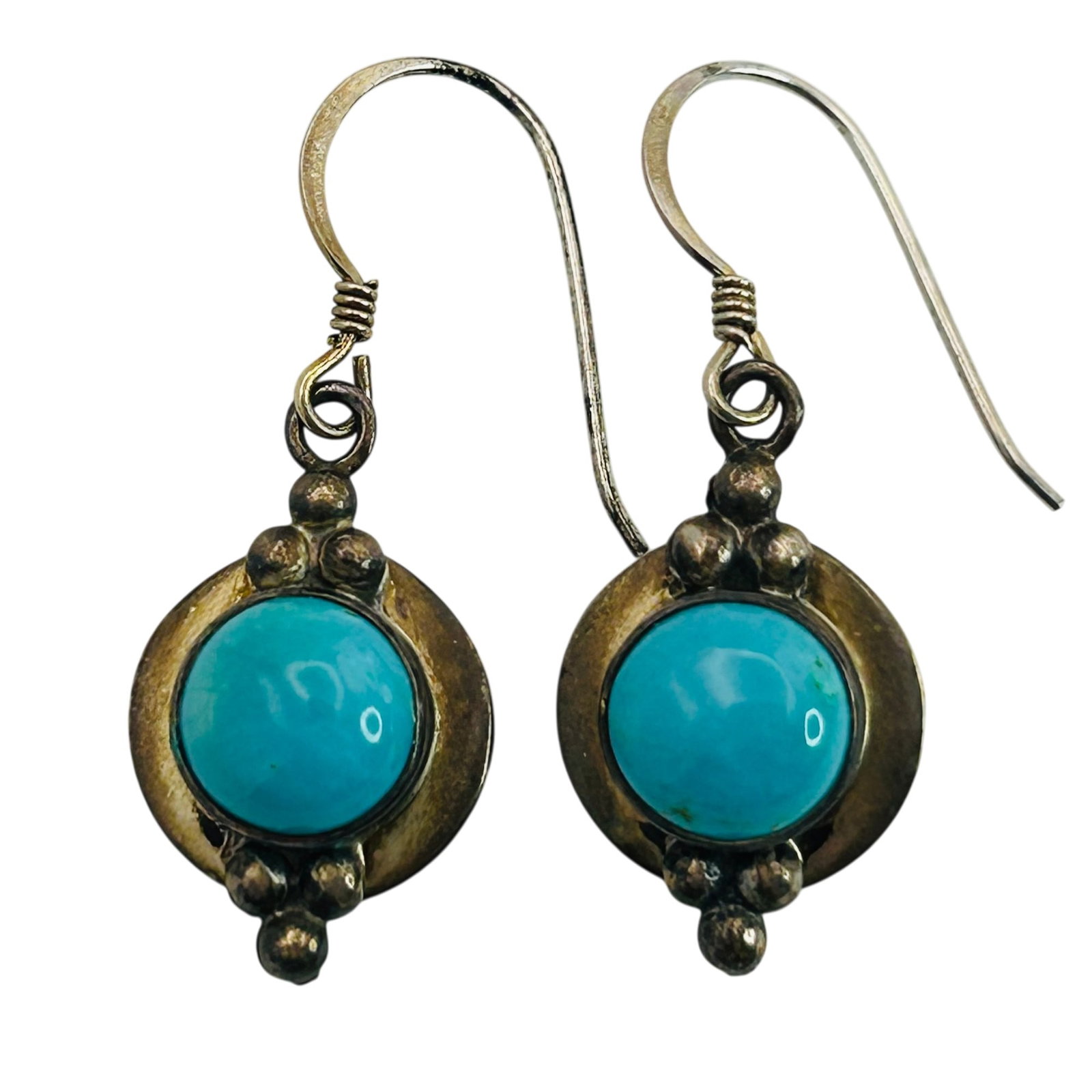 Sterling Turquoise Hook Back Earrings: Sterling turquoise hook back earrings. 3.60g