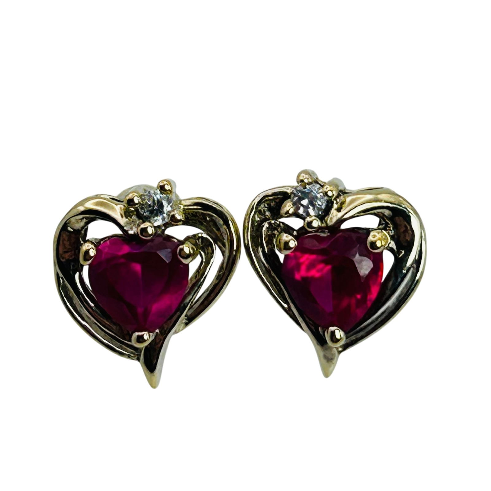 Sterling Ruby Cubic Zirconia Heart Stud Earrings: Sterling ruby cubic zirconia heart stud earrings. 1.50g