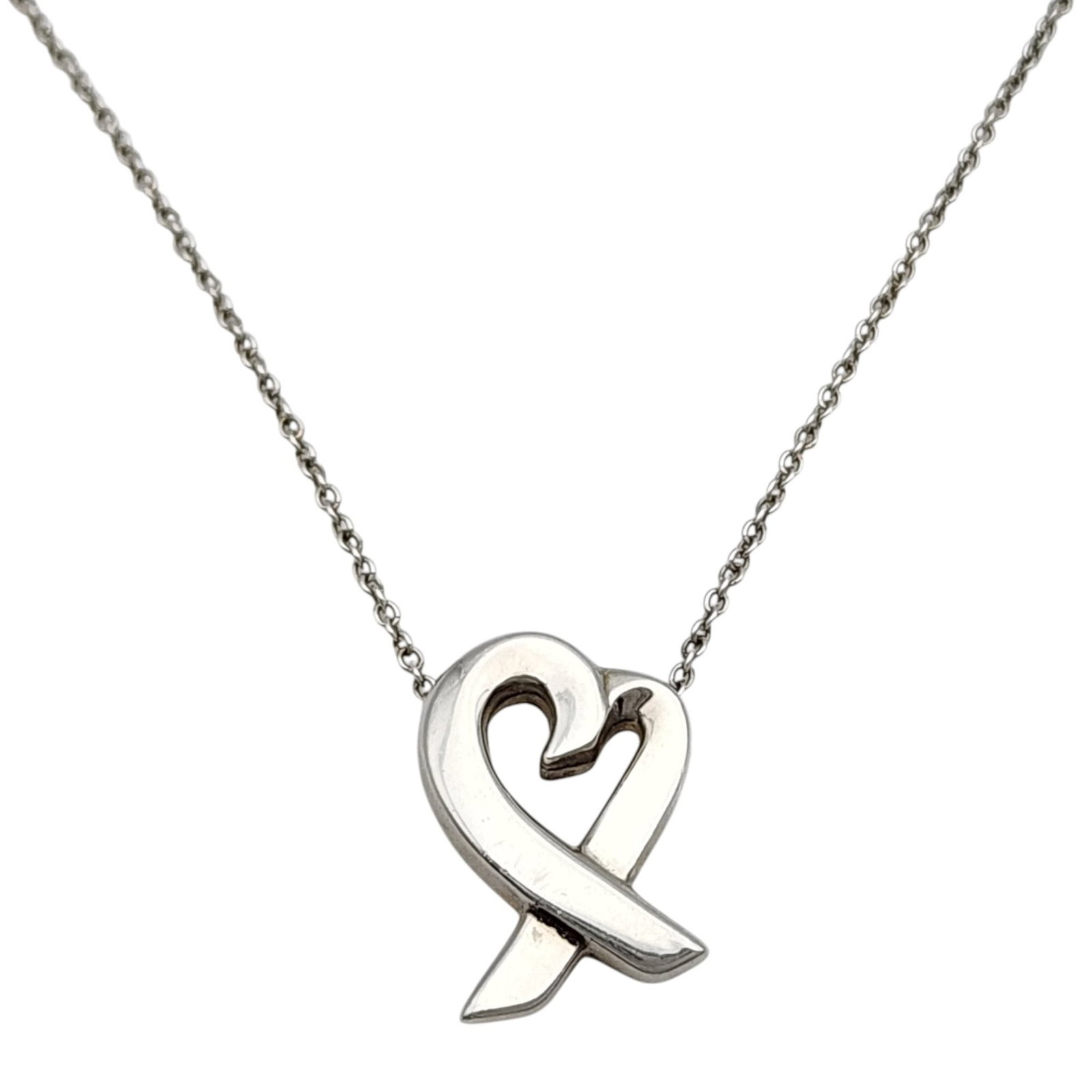 Tiffany & Co. Paloma Picasso Sterling Loving Heart Necklace: Tiffany & Co. Paloma Picasso Sterling Loving Heart Necklace, 16", pendant is approximately .6"l x .4"w - 2.8g, comes with Tiffany pouch as shown