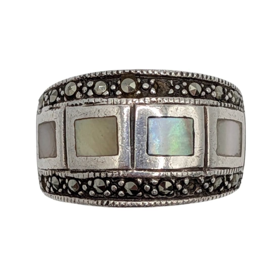 Sterling Silver Mother of Pearl Marcasite Inlay Band Ring: Sterling Silver, Mother of Pearl, Marcasite Inlay Band Ring. AS IS missing 3 stones. Size 7. Unsigned