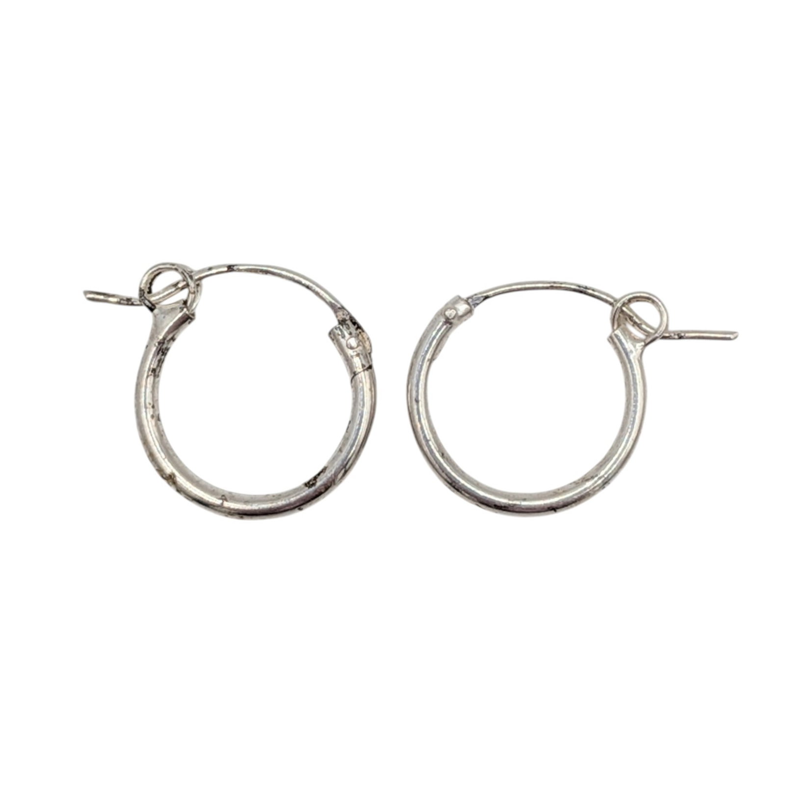 Signed Sterling Silver Petite Polished Hoop Earrings: Signed Sterling Silver Petite Polished Hoop Earrings. Signed 925 YN. .5g