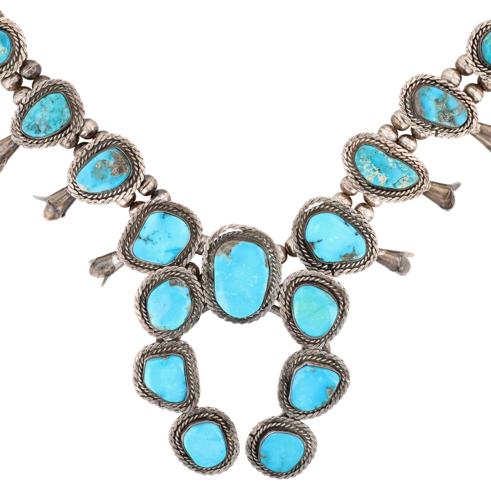 Vintage Navajo Sterling Turquoise Squash Blossom Necklace: Vintage Navajo Sterling Turquoise Squash Blossom Necklace | Weight: 178g | Approximate Length: 24" | Naja measures approximately 3.6" x 2.9" | Note: Surface abrasions present on some stones, one stone