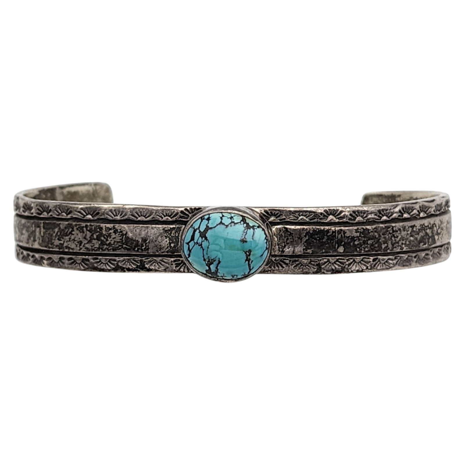 Signed Navajo Sterling Turquoise Stamped Cuff Bracelet: Jesse V. Navajo for Circle JW (Jack Whittaker) Sterling Stamped Turquoise Cuff Bracelet | Weight: 23.5g | Approximate Inner Circumference (Including Gap): 7" | Gap: 1.75"