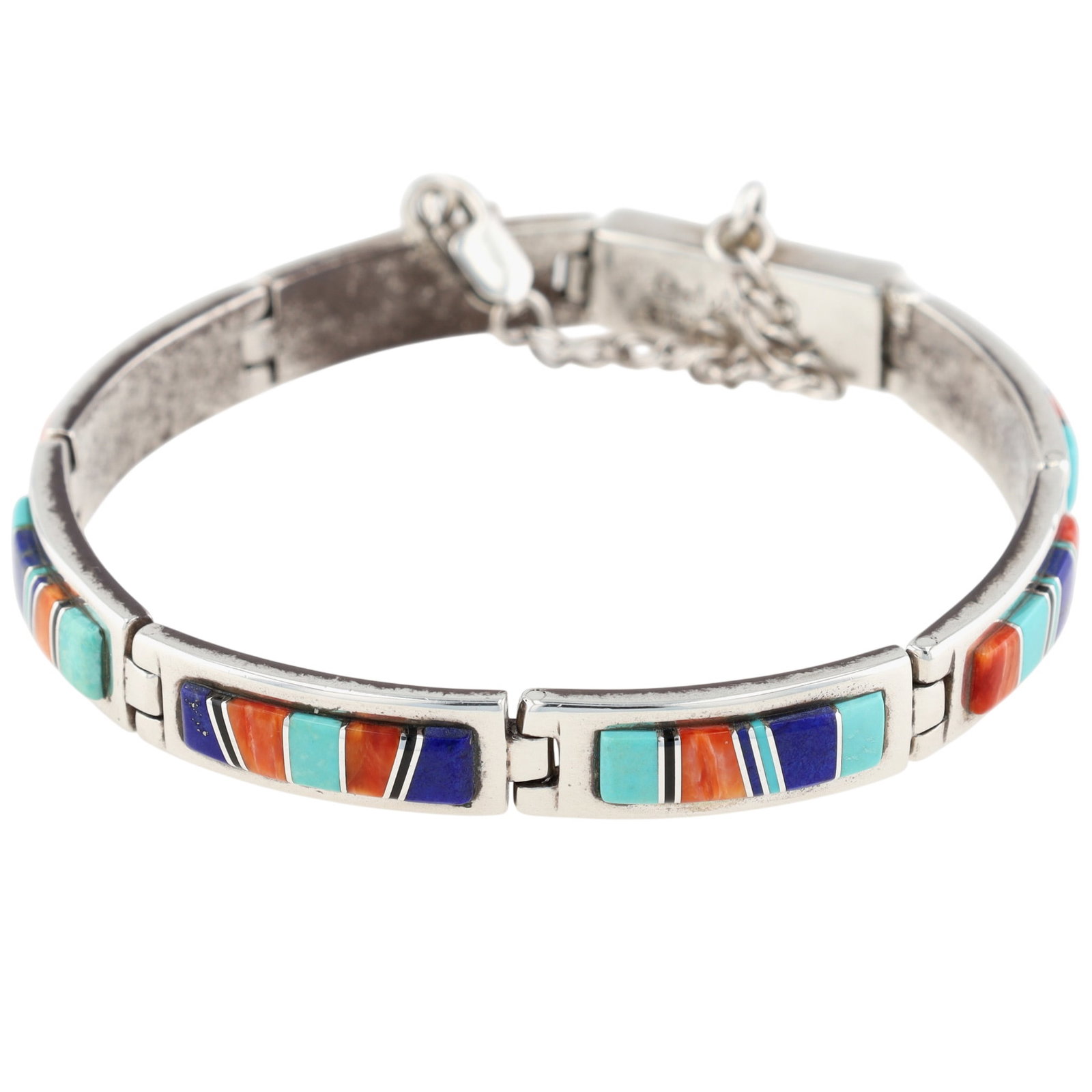 Calvin Begay Navajo Sterling Multi-Stone Inlay Bracelet: Calvin Begay Navajo Sterling Multi-Stone Inlay Bracelet | Weight: 27.5g | Turquoise, Lapis Lazuli, Spiny Oyster, Jet | Length, unclasped: 7.5" | Inner circumference, clasped: 6.5"