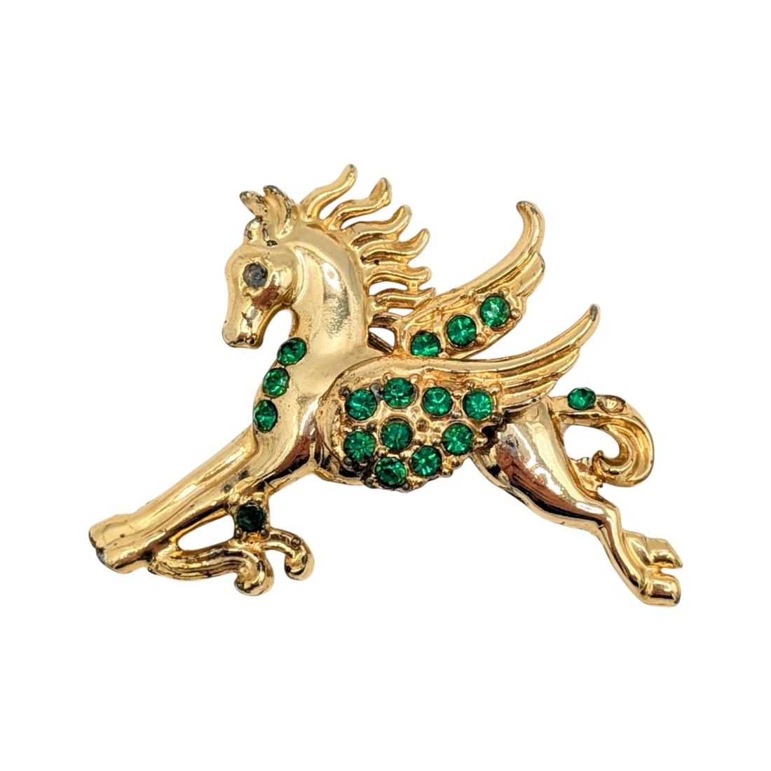 Signed Gold Tone Green Rhinestone Pegasus Brooch: Signed Gold Tone Metal, Green Rhinestone Pegasus Brooch. AS IS Missing 2 Stones. Signed x in circle. 13.8g