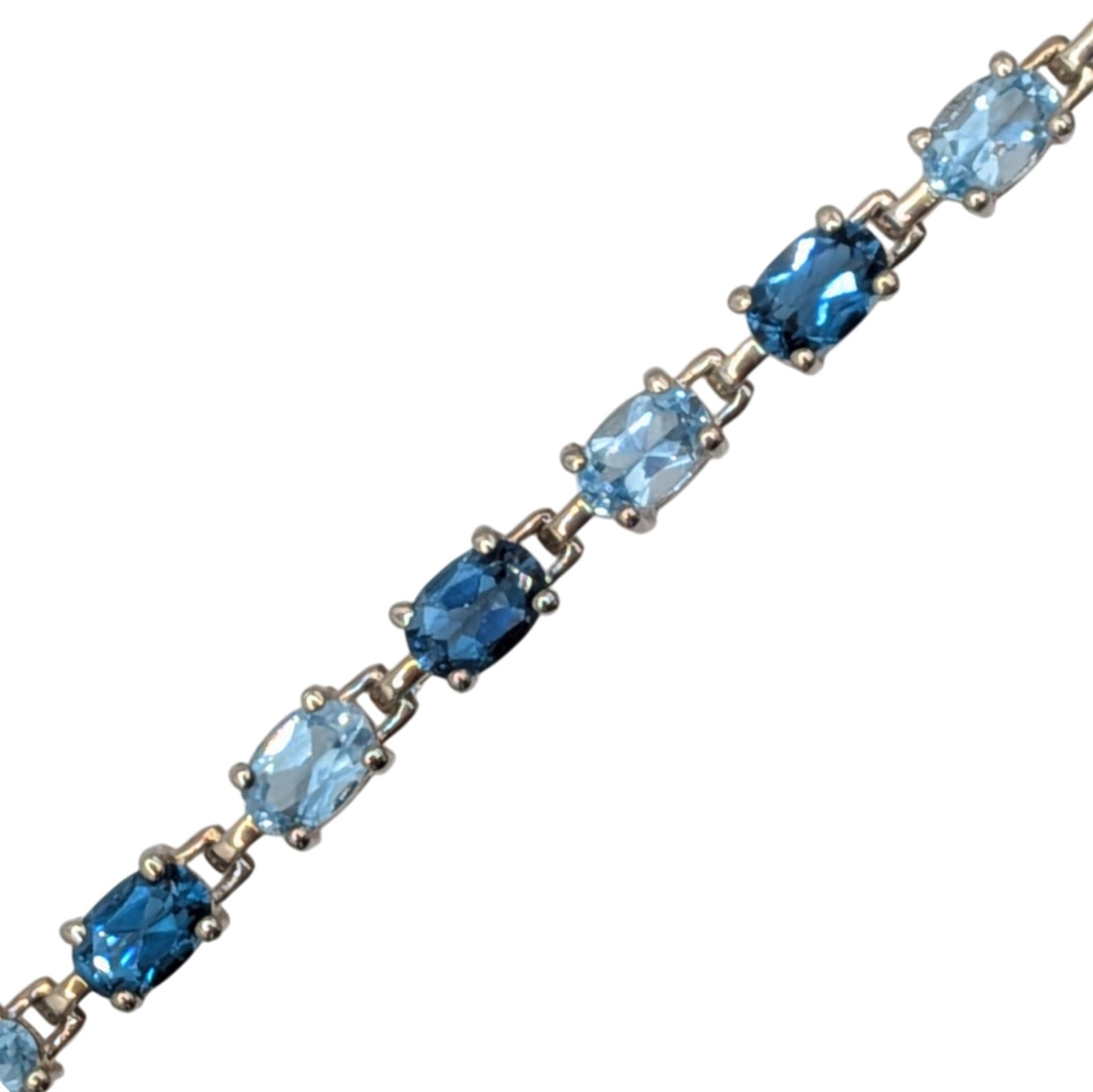 Signed Sterling Silver Blue Topaz Two Tone Oval Cut Tennis Bracelet: Signed Sterling Silver, Blue Topaz Two Tone Oval Cut Tennis Bracelet. 7.75in Length. Signed ADI 925 Thailand. 11.5g