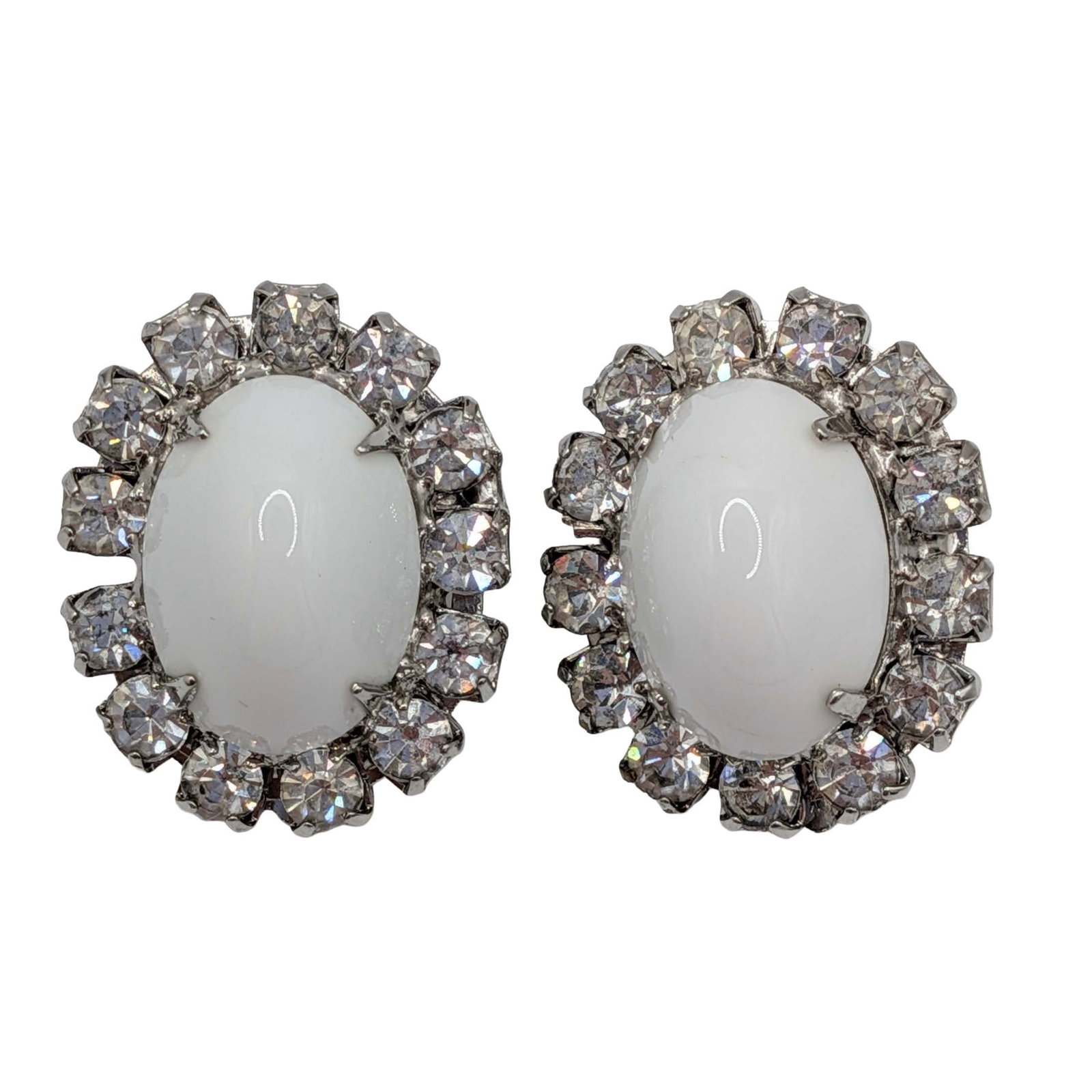 Weiss Silver Tone White Rhinestone Oval Halo Earrings: Weiss Silver Tone Metal, White Rhinestone Cabochon White Rhinestone Halo Oval Clip Back Earrings. Signed Weiss. 16.5g