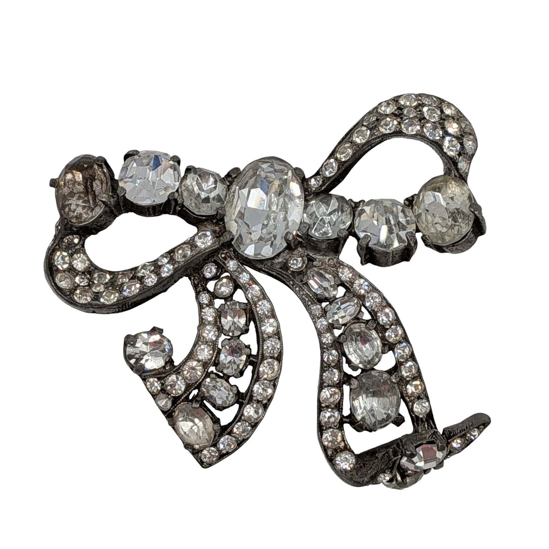 Eisenberg Silver Tone Rhinestone Bow Brooch: Eisenberg Silver Tone Metal, Rhinestone Bow Brooch. AS IS pin back missing. Signed Eisenberg Original. 51.1g