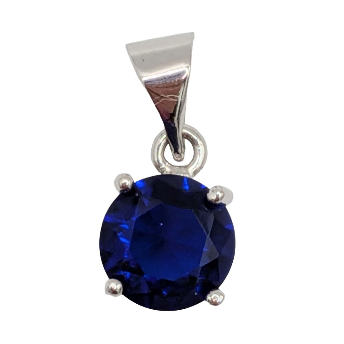 Silver Plated Blue Rhinestone Brilliant Cut Pendant: Silver Plated Metal, Blue Rhinestone Brilliant Cut Pendant. .6g