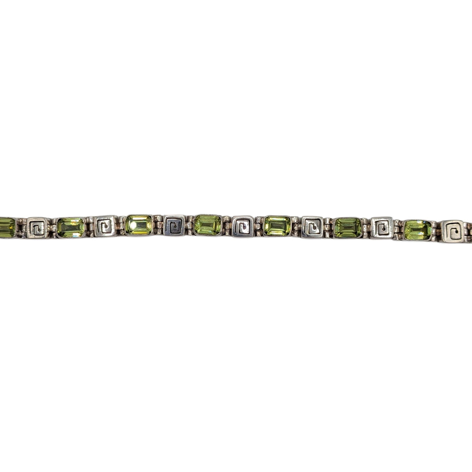 Sterling Silver Green Rhinestone Spiral Link Tennis Bracelet: Sterling Silver, Green Rhinestone Pierced Spiral Link Tennis Bracelet. 7.25in Length. Signed 925. 18.2g