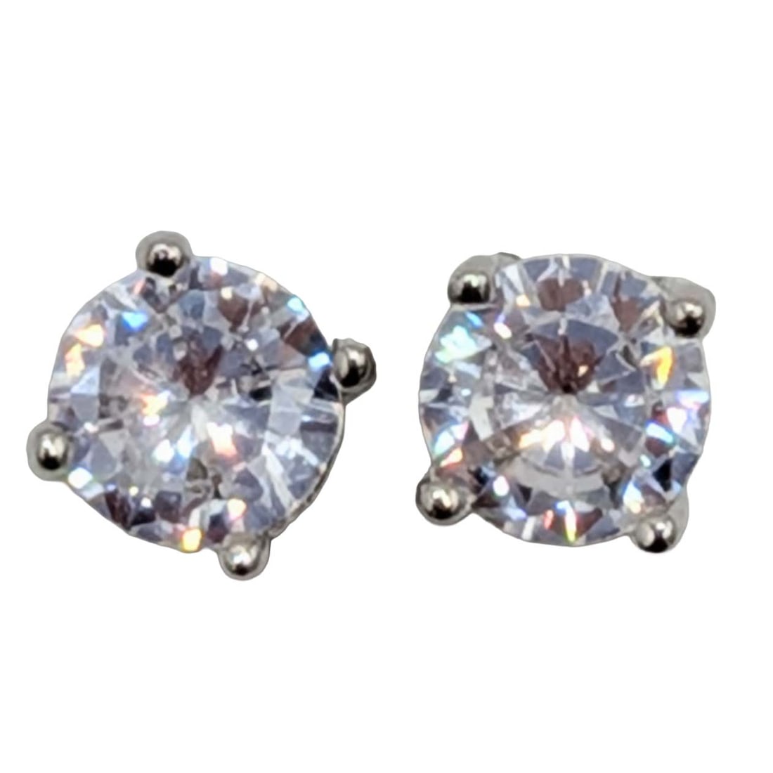 Signed Sterling Silver CZ Solitaire Stud Earrings: Signed Sterling Silver, CZ Solitaire Stud Earrings. Signed y symbol 925 China. .8g