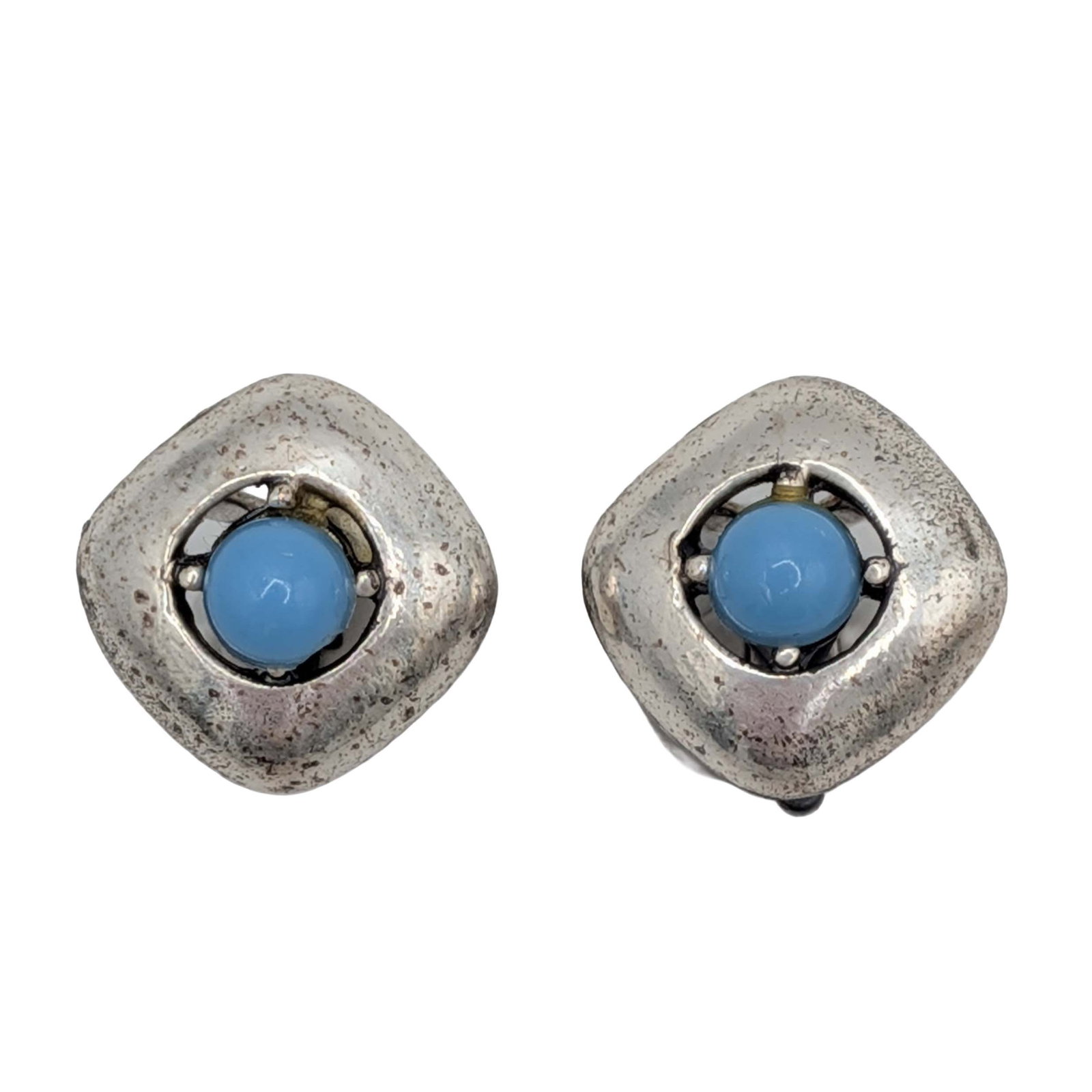 Southwest Silver Tone Faux Turquoise Earrings: Southwest Silver Tone Metal, Faux Turquoise Clip Back Earrings. Signed Patented. 6g