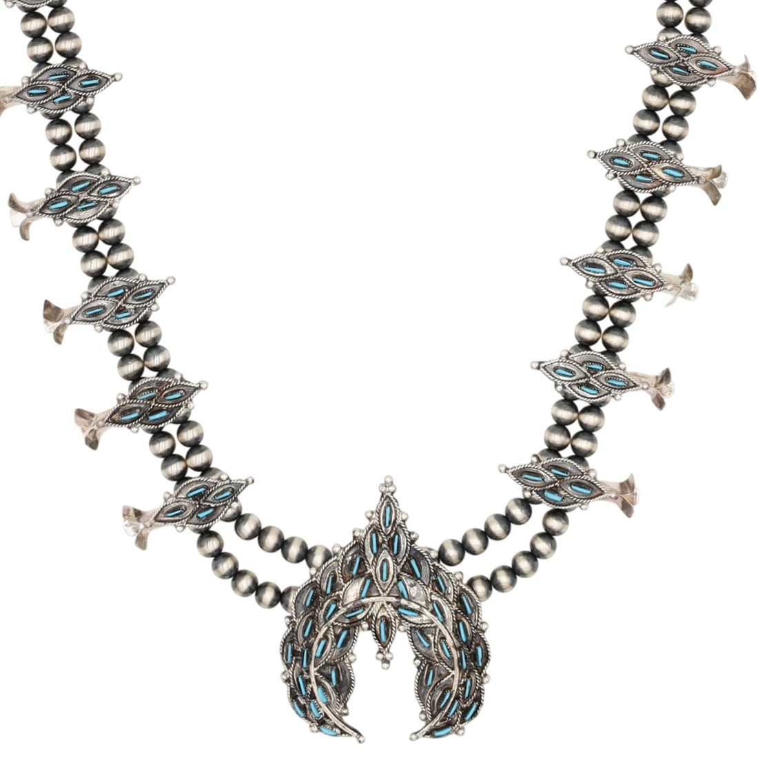 Lerna Mahkee Zuni Sterling Kingman Turquoise Needlepoint Squash Blossom Necklace: Lerna Mahkee Zuni Sterling Block Kingman Turquoise Needlepoint Squash Blossom Necklace / 68g / Unsigned by artist. Marked Zuni. Artist attribution based on accompanying tag.