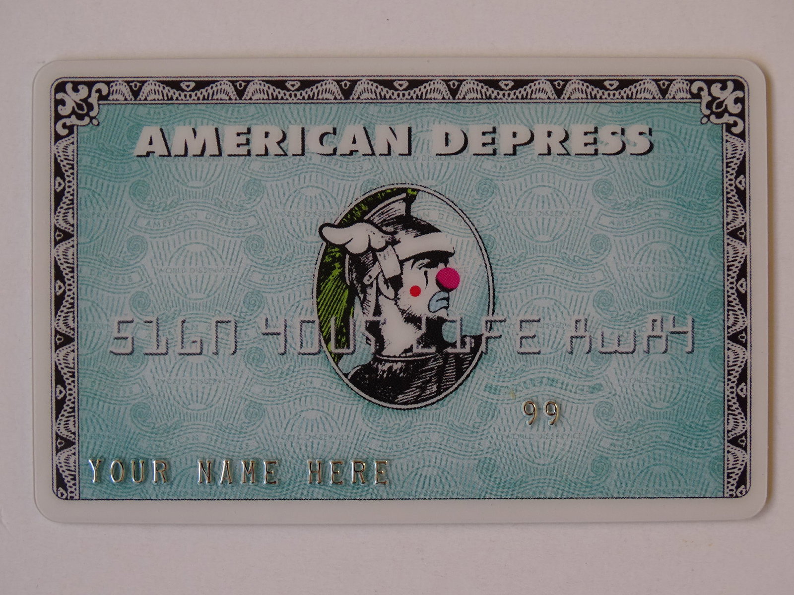 America Dface Depress card, Banksy: American Dface Depress card from Dismaland 2015, ca 8.5x5.5cm, Banksy ink hand stamped seal on the back