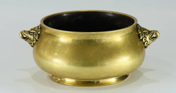 A large size bronze censer: A large size bronze censer from 17th century, decorated with double Capricorn heads and carved six-character year mark on the base. With original wooden seat. Provenance: From the collection of