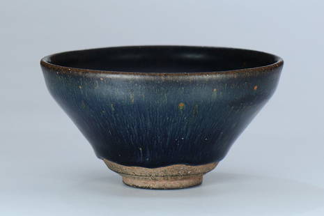 A Jian kiln black-glazed tea bowl: A Jian kiln black-glazed tea bowl from the Song Dynasty, and decorated with light blue hair-like filaments.Provenance: I.K. Gallery AUS, a private collector in Australia.