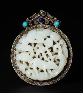 A silver-wrapped jade pendant from the Qing Dynasty: A silver-wrapped jade pendant from the Qing Dynasty. The round jade piece is hollowed out and embossed with cranes, deer, and Ganoderma lucidum. It is wrapped in sterling silver with the blessing of "