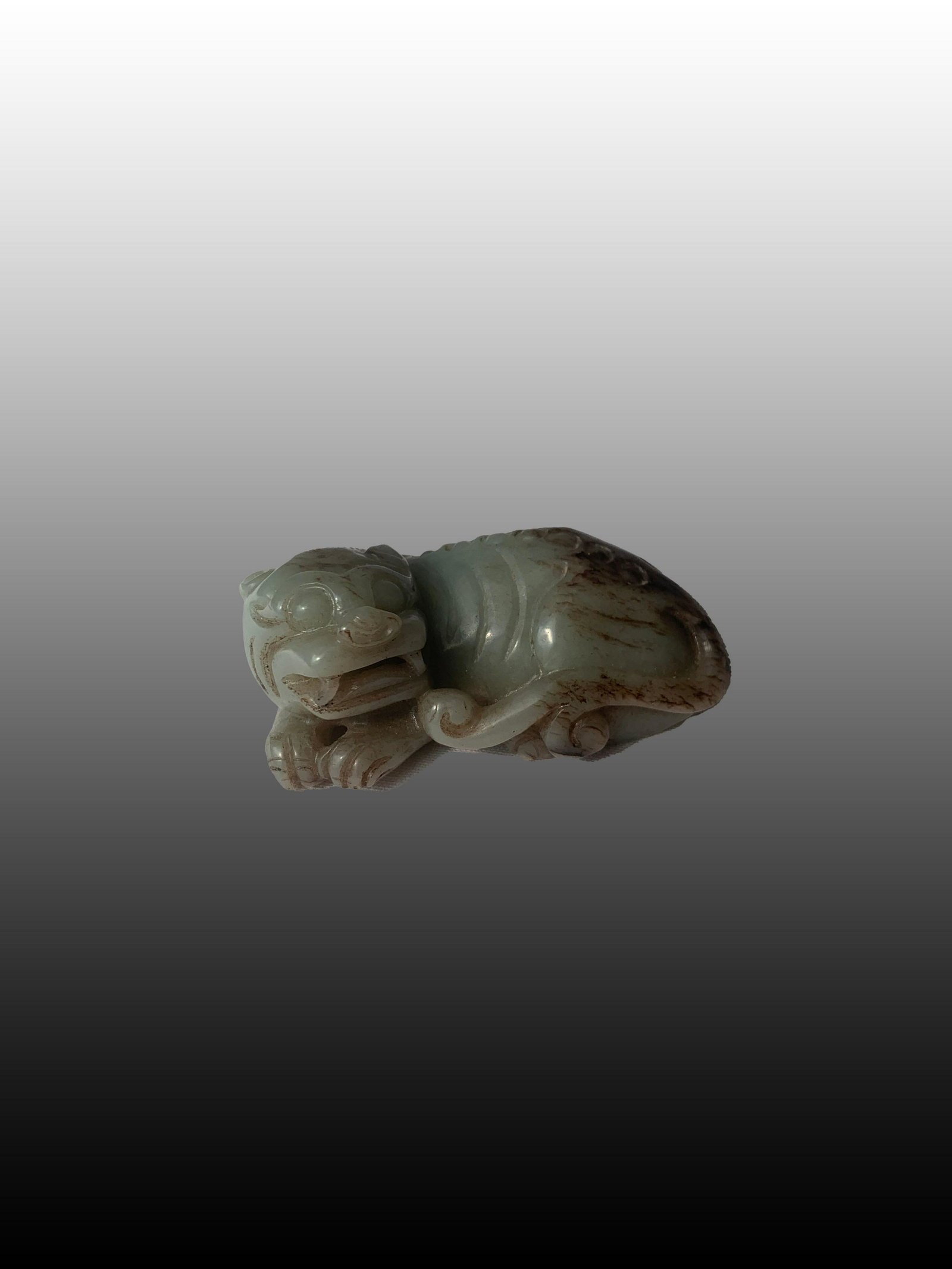 19thc Chinese Jade recumbent Figure of a Foo Dog: 19th c Jade Recumbent Figure of a Foo Dog. This item was purchased by the client through Skinners Auction a number of years ago.