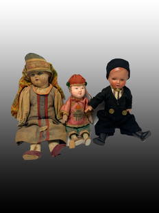 Lot of Small Antique Dolls: A lot of 3 small antique dolls; one male chinese in original clothing, one celluloid male child in original clothing, and one made in the Soviet Union with glass eyes.