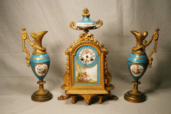 Sevres Gilt Porcelain Clock and Garniture: Sevres clock and garnture set, "Milroy and Reguier, Co."
