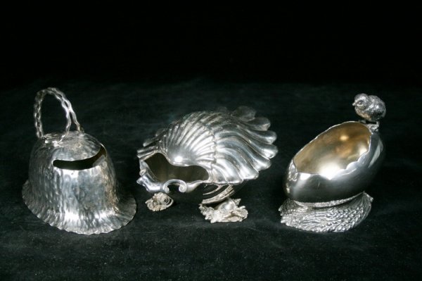 Group of Victorian English Spoon Warmers: Group of three: Hewken & Heath shaped as helmet, chick perched on egg and covered shell atop conch shell feet