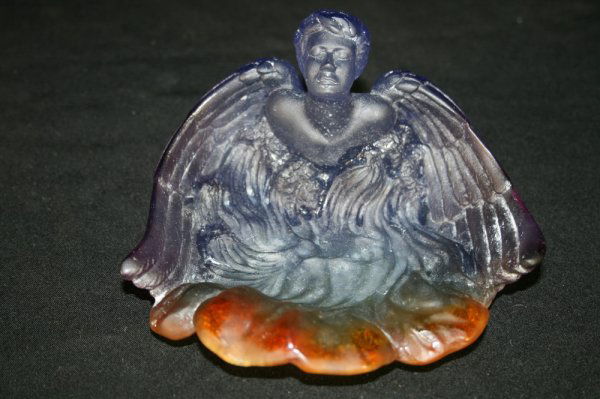 A Daum Nancy Pate de Verre Dish: The dish is designed as an angel and is marked Daum France on the underside, 3 3/8" x 6