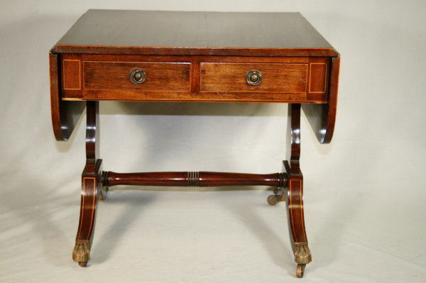 Mahogany Coffee Table: A small coffee table with drop leaf sides