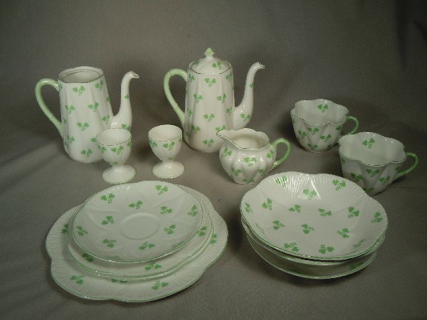 Shelley China Luncheon Set: Green clover luncheon set. 14 pieces of Shelly china comprising of 2 cups, 2 servers, 2 egg cups, 1 creamer cup, 2 bowls, and 5 plates.