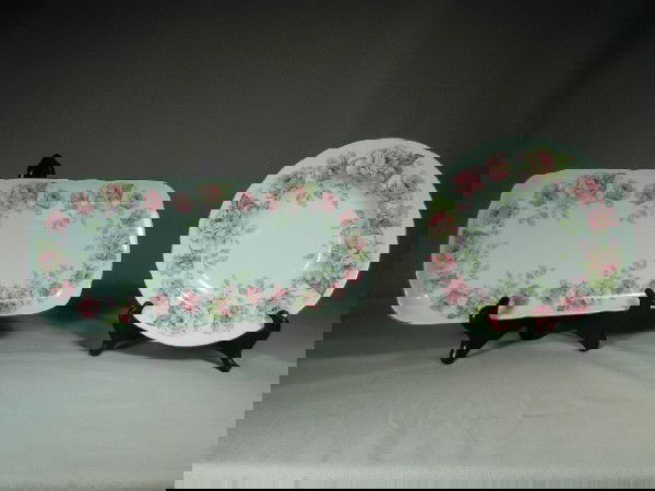 Bernardaud Limoges China, "Eugenie De Montijo": 8 soup bowls along with serving tray. Pink and yellow roses on a white background with a green trim.
