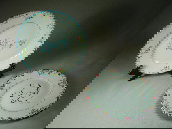 Limoges China, John Lennon Plates: Two Limoges France plates hand-painted with an original drawing by John Lennon. Sold through the John Lennon estate and certified by Yoko Ono Lennon, 1987; one entitled "The Family" and the other enti