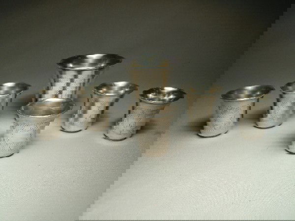 Sterling Silver Jiggers, Paston - New York: Six sterling silver chaised jiggers by Paston, New York, weighing 8 T.O.