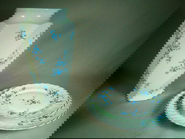 Bernardaud Limoges China, "Myosotis": Nine pieces total; five dinner plates and three luncheon plates, one limoges france floral vase, 11 1/2" tall. Pattern of small blue flowers with gold trim.