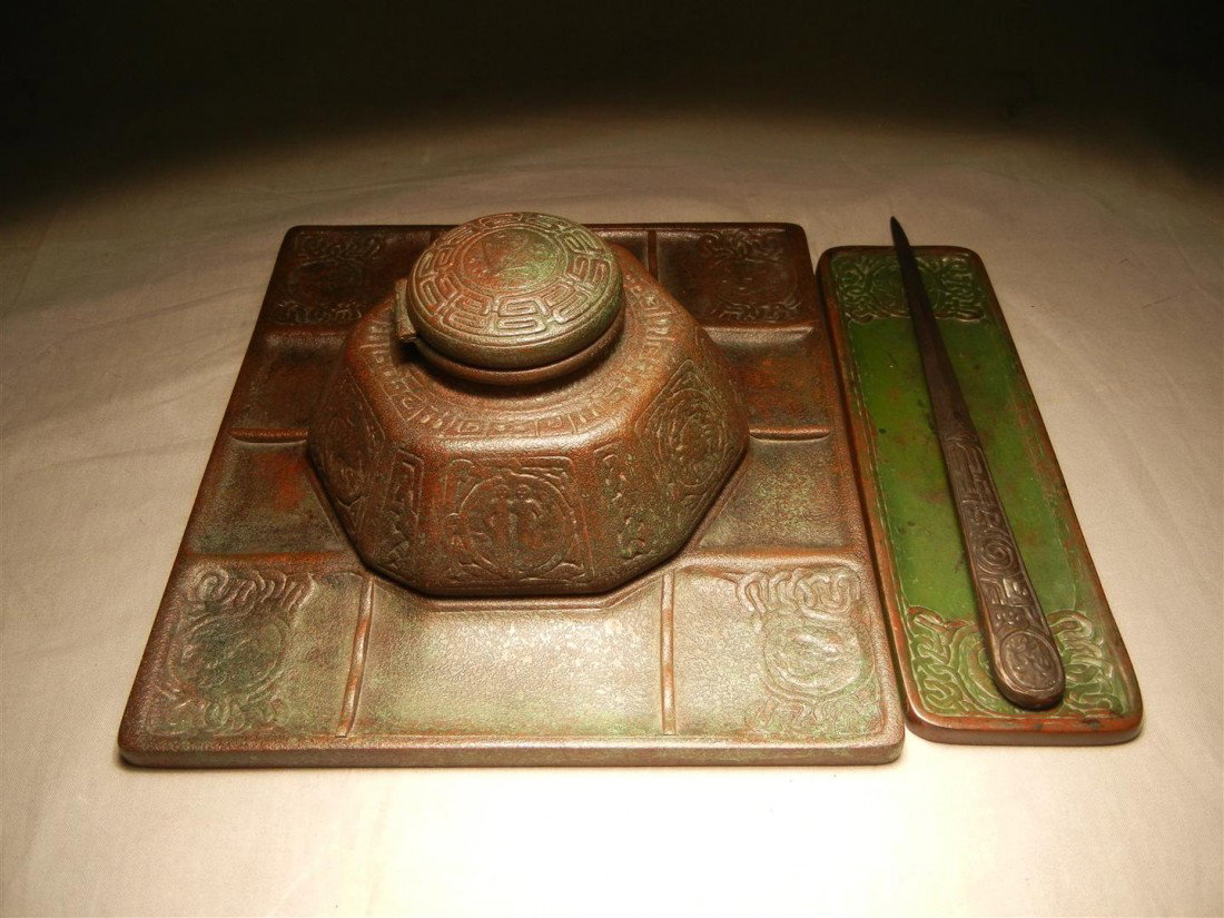 Tiffany Bronze Desk Set, Zodiac Pattern: Unique Tiffany bronze desk set with a zodiac pattern. Set contains one inkwell(4" x 8"), one pen tray(10"), and one letter opener. All pieces have "Tiffany Studios New York" engraved on them (see phot